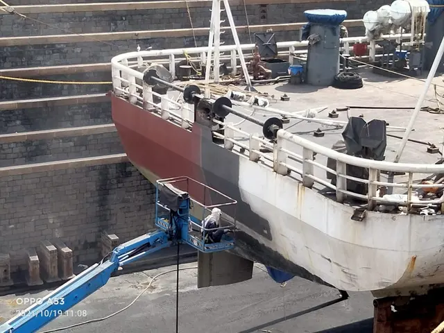 Surface preparation and grit blasting on a vessel hull