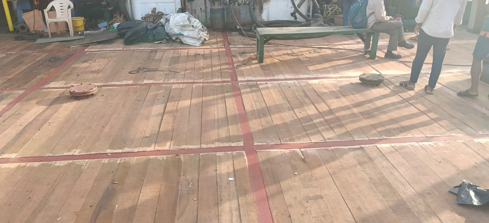 Teak wooden deck newly laid on a vessel's open deck